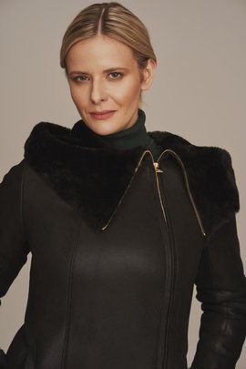 Women's black sheepskin coat with a hood